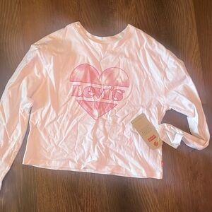 This is a brand new white shirt. It’s a long sleeve